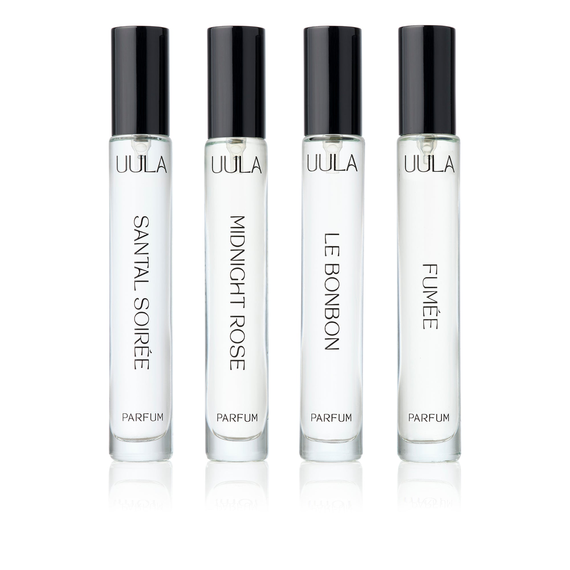 UULA Travel Collection fragrance set with four 10 ml bottles neatly presented. The bottles represent a perfume passport, offering scents for different occasions, from exotic sunsets and sophisticated evenings to starlit adventures and joyous moments.